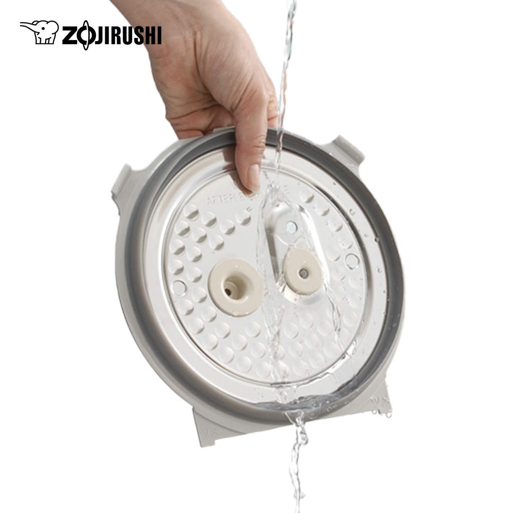 Cách vệ sinh nồi cơm điện cao tần sạch đúng cách 2 Tháo rời nắp trong và rửa dưới vòi nước ấm